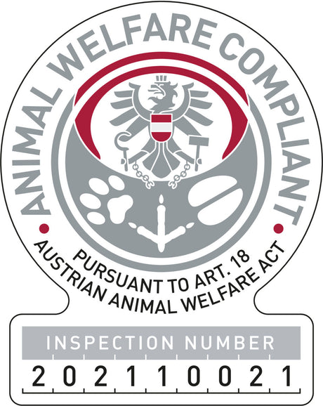 Rundes Siegel mit Adler und Schriftzug "Animal Welfare Compliant Pursuant To Art. 18 Austrian Animal Welfare Act".
