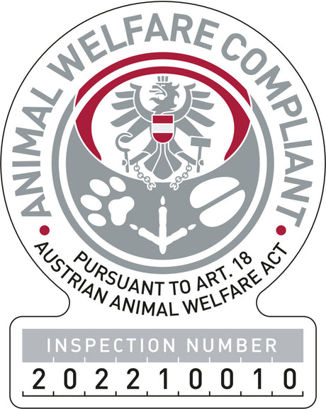 Siegel für Tierschutzkonformität mit Adler und Text "Animal Welfare Compliant" sowie Prüfnummer "202210010".
