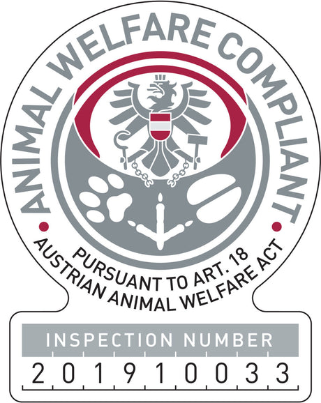 Tierwohl-Abzeichen mit Adler, Pfotenabdruck und Text "Animal Welfare Compliant" und "Inspection Number 201910033".