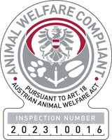 Siegel mit Text "Animal Welfare Compliant, Pursuant to Art. 18 Austrian Animal Welfare Act, Inspection Number 202310016".