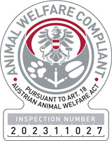 Rundes Siegel mit Adler, Text "Animal Welfare Compliant" und "Pursuant to Art. 18 Austrian Animal Welfare Act", Inspektionsnummer 202311027.