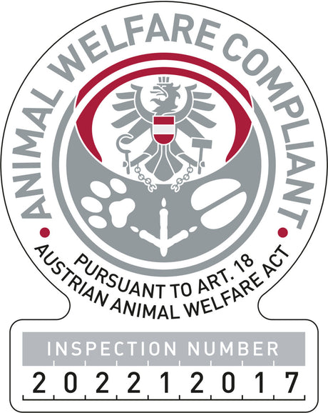 Logo mit Adler, grauen und roten Elementen, Text "Animal Welfare Compliant" und "Pursuant to Art. 18 Austrian Animal Welfare Act", Inspektionsnummer 202212017.