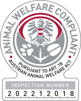 Rundes Siegel mit Adler und Text "Animal Welfare Compliant, Pursuant to Art. 18 Austrian Animal Welfare Act".