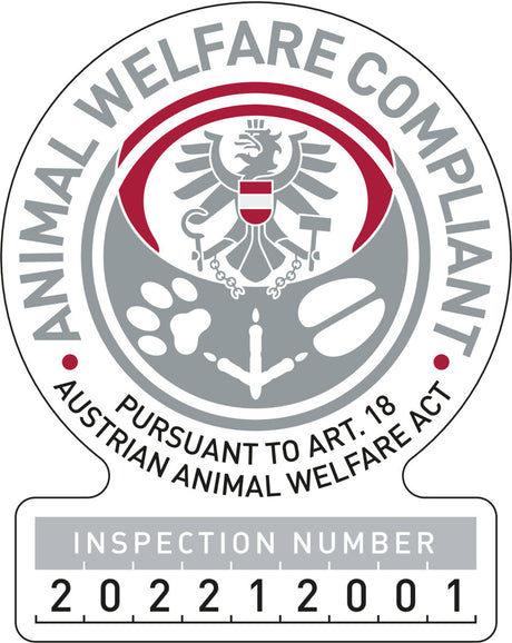 Tierwohl-Logo mit Adler, Pfotenabdruck und Text "ANIMAL WELFARE COMPLIANT" und "INSPECTION NUMBER 202212001".