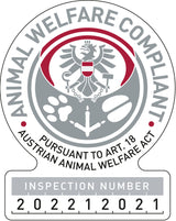 Siegel mit grauem Adler und roten Akzenten, Text: "Animal Welfare Compliant, Pursuant to Art. 18 Austrian Animal Welfare Act," Inspektionsnummer 202212021.