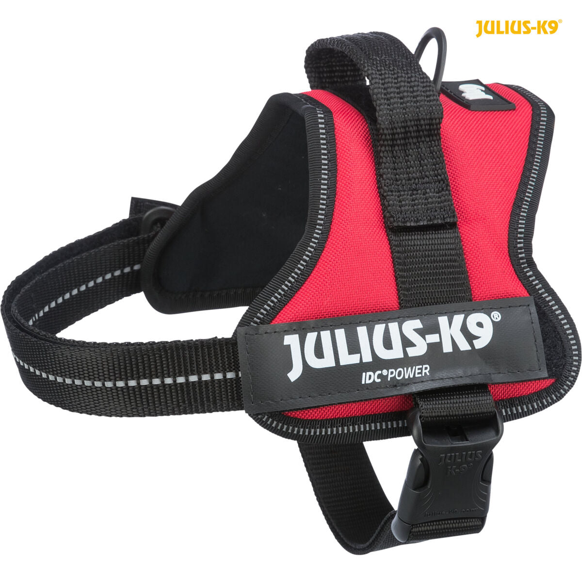 Rotes Hundegeschirr mit schwarzem Verschluss und reflektierenden Details, Markenname "Julius-K9" sichtbar.