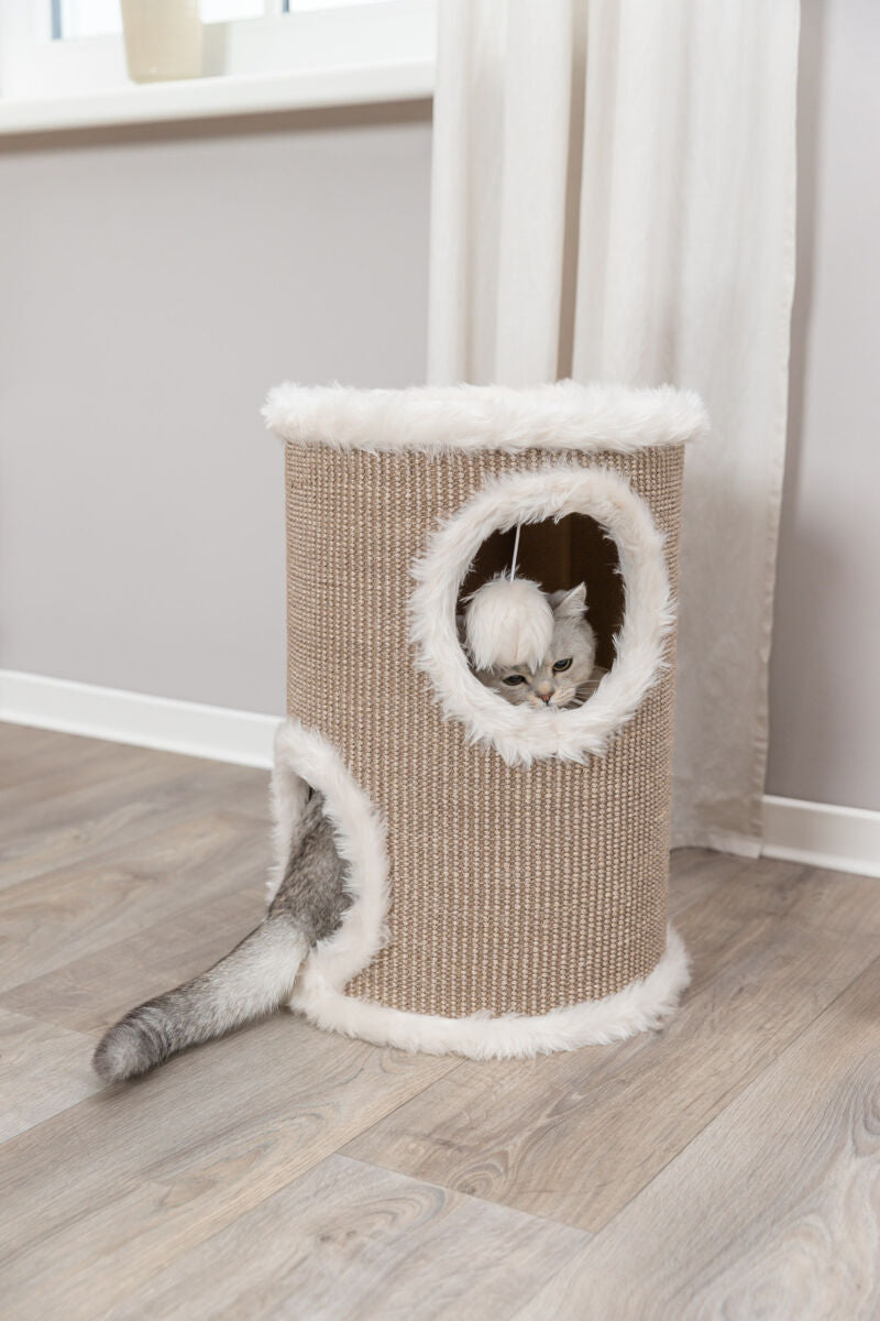 Katzenhöhle aus beigem Material mit weißen Plüschkanten, eine Katze schaut aus einem runden Fenster.