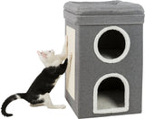 Schwarz-weiße Katze kratzt an einer grauen Kratzsäule mit zwei runden Öffnungen und weicher Umrandung.