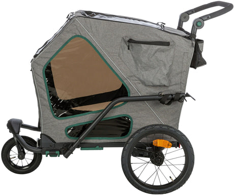 Grau-schwarzer Fahrradanhänger mit großen seitlichen Sichtfenstern, verstellbarem Griff und zwei Rädern.