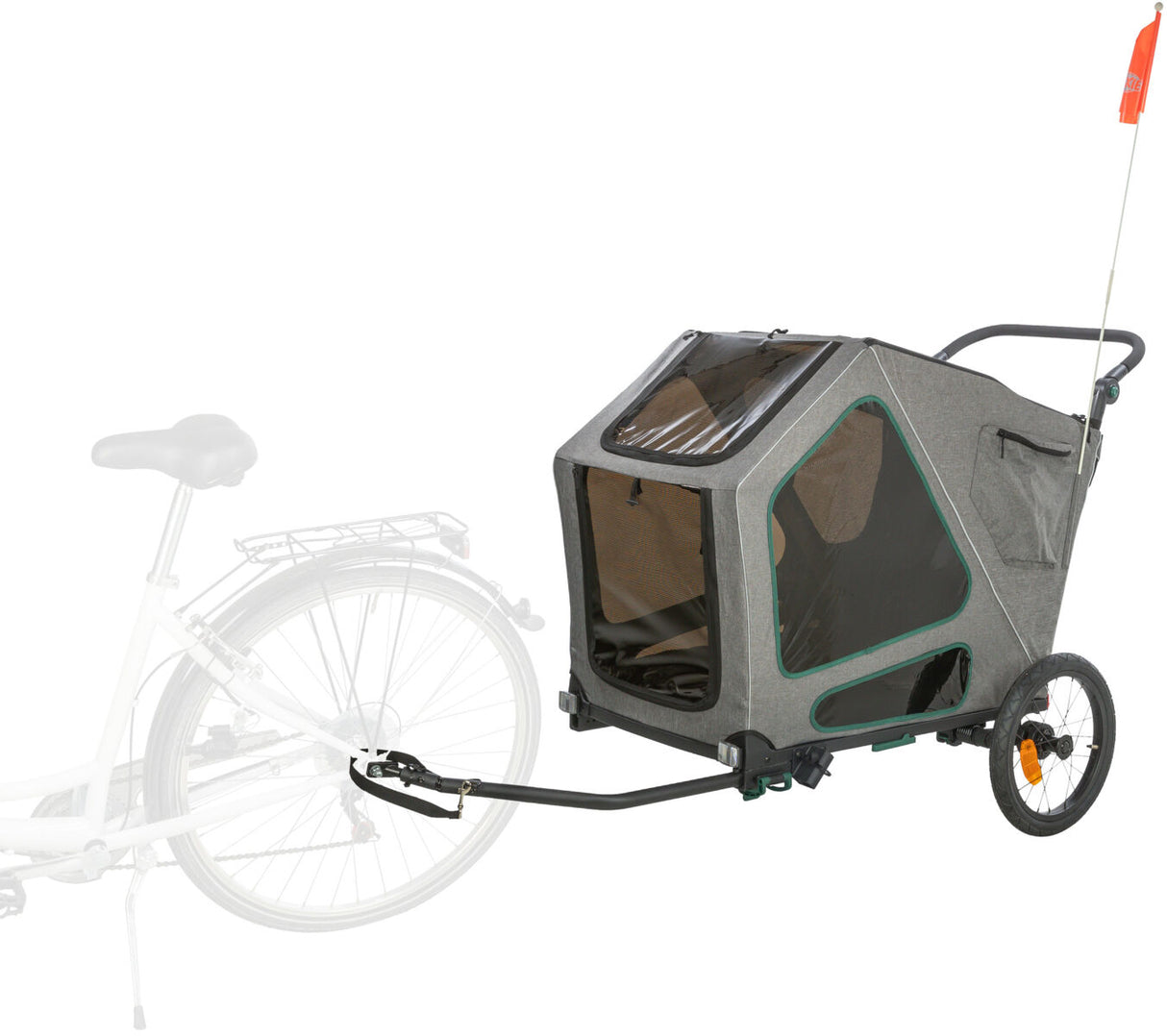 Fahrradanhänger in Grau mit zwei Rädern und transparenter Abdeckung, angekoppelt an ein Fahrrad.