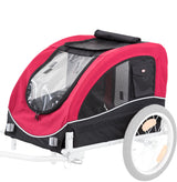 Roter und schwarzer Fahrradanhänger mit klaren und netzartigen Elementen, zwei Räder und ein vorderes Fenster.