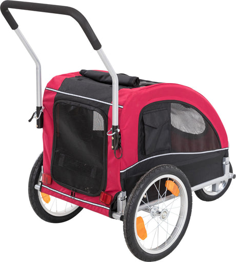 Roter Fahrradanhänger mit schwarzem Netzfenster, zwei großen Rädern mit orangefarbenen Reflektoren, schwarzem Griff.