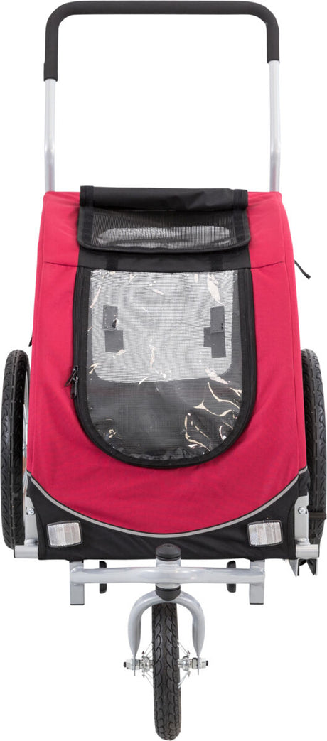 Roter Fahrradanhänger mit schwarzem Rand, zwei großen Rädern und vorderem Netzfenster, seitlichem Reflektor.