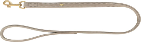 Beige Leine aus Leder mit goldfarbenem Karabinerhaken, Trixie-Logo sichtbar, geschwungene Form.