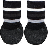 Zwei schwarz-weiß gestreifte Hundesocken mit rutschfester, strukturierter Sohle.