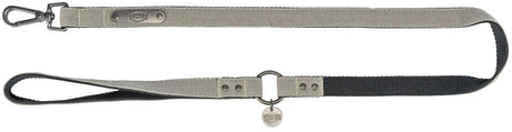 Beige und schwarze Hundeleine mit Metallverschluss und Markenplakette, versehen mit „TRIXIE“-Schriftzug.