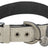 Ein beige-graues Hundehalsband mit Metallschnalle, Ösen, D-Ring und einem Trixie-Logo am Anhänger.