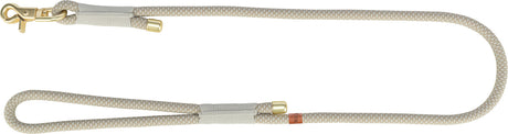 Beige Hundeleine mit goldfarbenem Karabiner und gewebtem Muster, Text "Ruff" auf braunem Etikett.