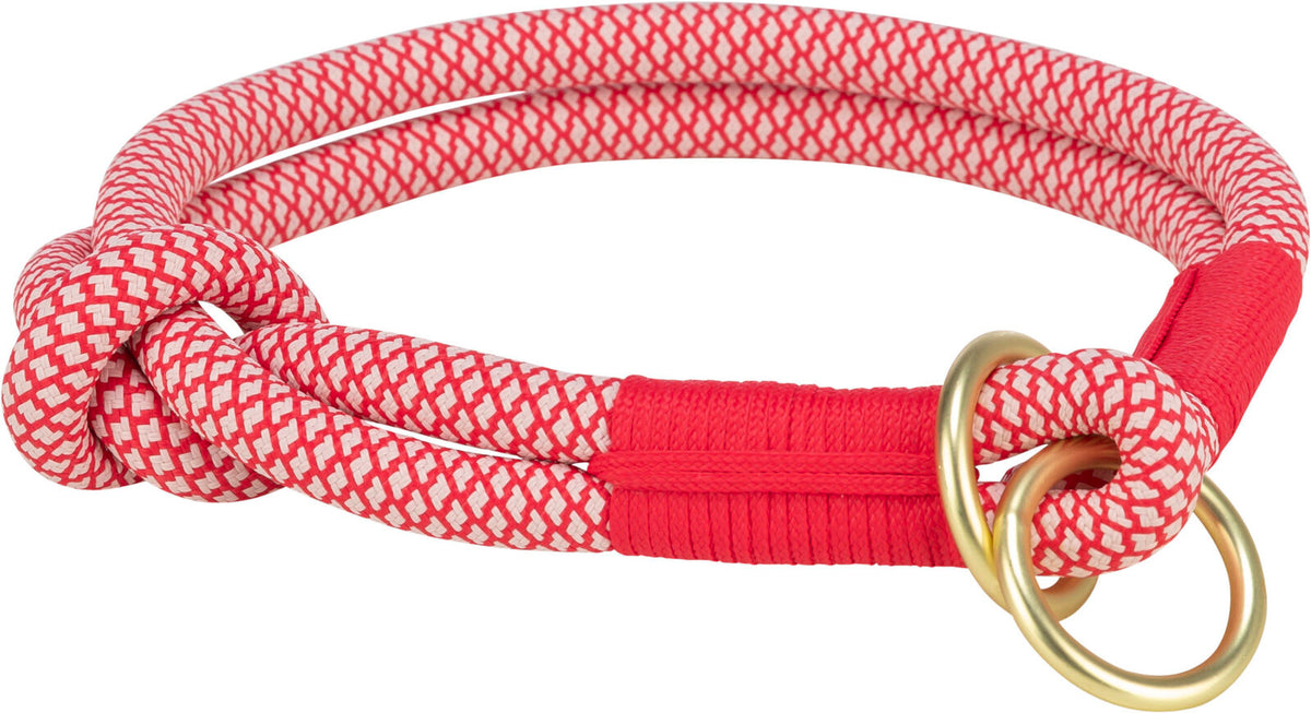 Rotes und weißes, gemustertes Seil mit Knoten, bestehend aus zwei goldenen Metallringen.