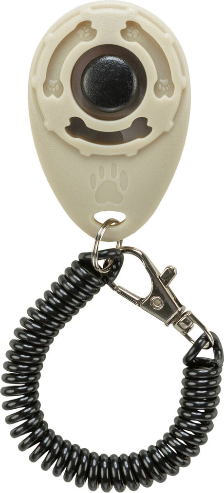 Beiges Clicker-Gerät mit schwarzer Spiralschnur und Metallclip zur Befestigung, Pfotenmuster erkennbar.