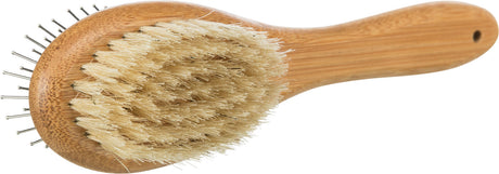 Holz-Körperbürste mit Naturborsten und Metallstiften, gerundeter Griff, hellbraune Farbe.