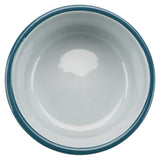 Weiße runde Schüssel mit dunkelblauem Rand, von oben fotografiert, sie hat eine glatte, glänzende Oberfläche.