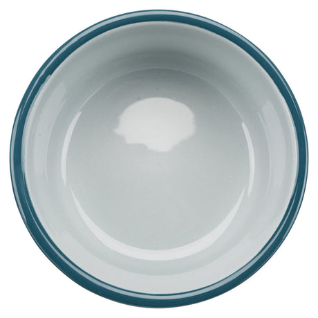 Weiße runde Schüssel mit dunkelblauem Rand, von oben fotografiert, sie hat eine glatte, glänzende Oberfläche.