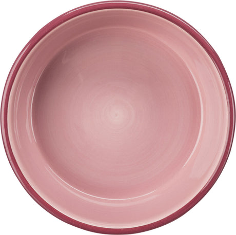 Rosafarbene, runde Schüssel aus Keramik mit glattem, glänzendem Finish und leicht dunklerem Rand.