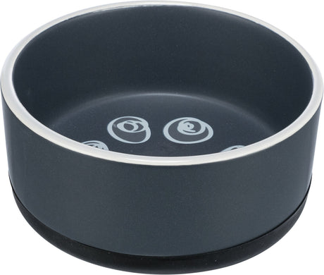 Grauer Futternapf mit weißem Rand und spiralförmigen Mustern innen auf dem Boden.