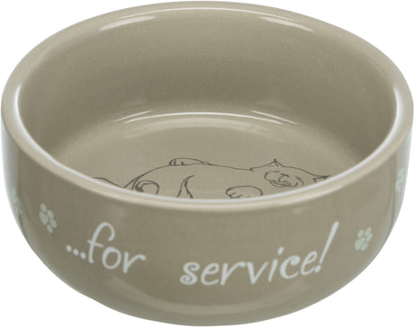 Beige Futterschale mit Katzendruck und Aufschrift ”...for service!”, umrandet von Pfotenmotiven.