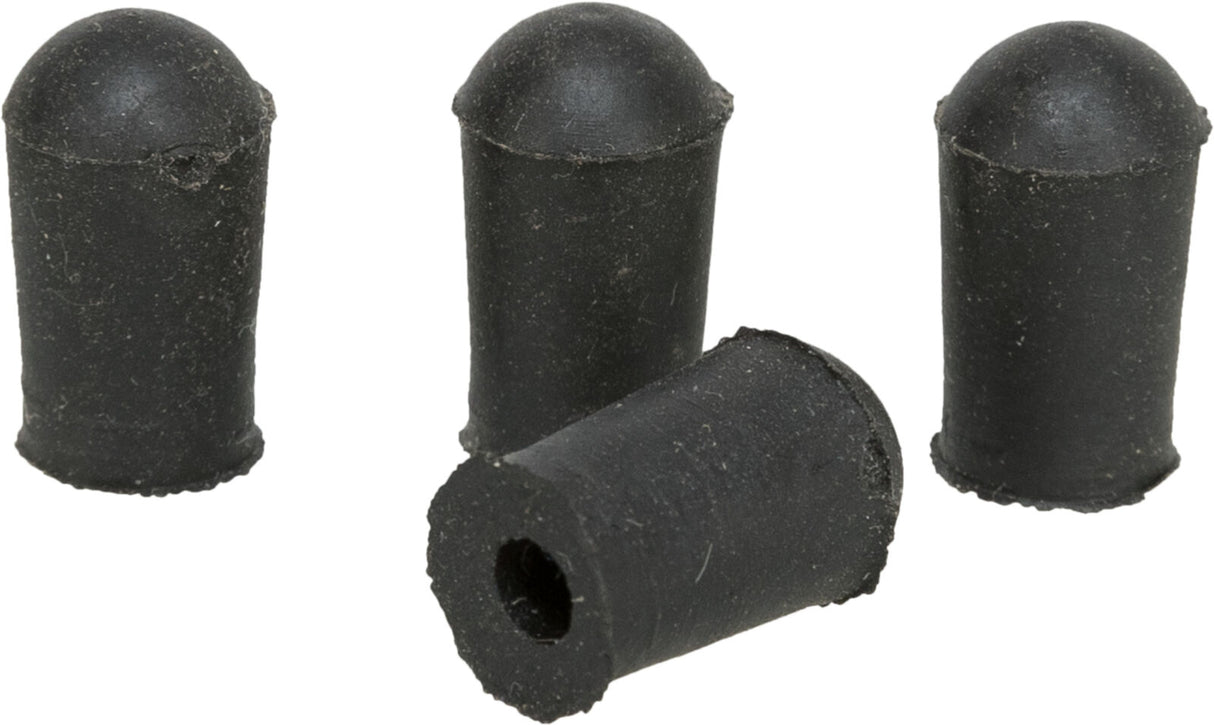 Vier schwarze zylindrische Gummistopfen, einer liegend mit offener Seite nach vorne.