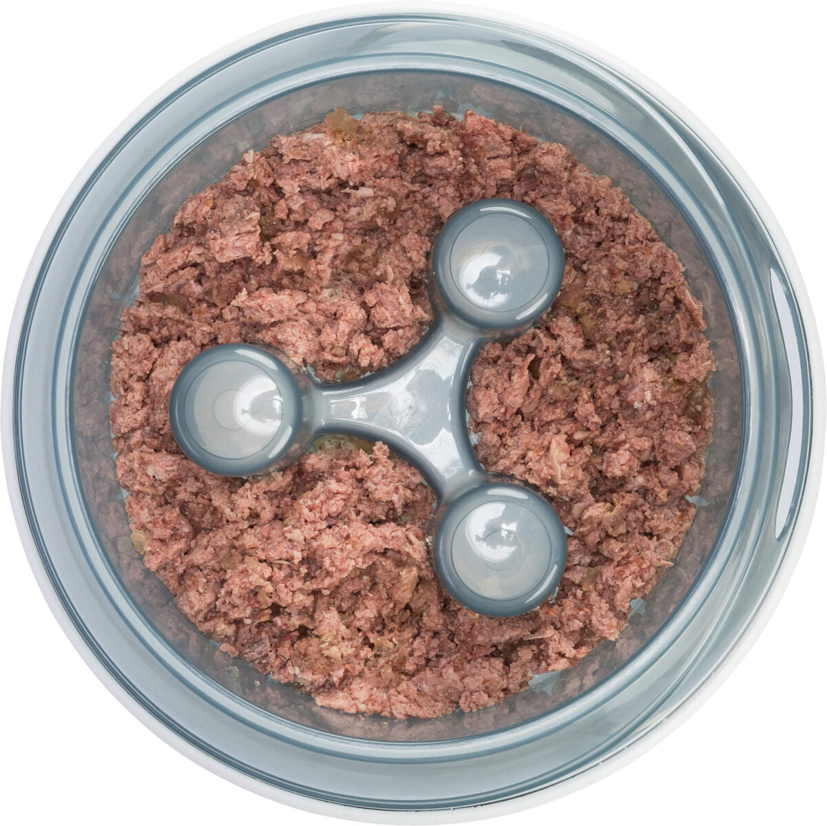 In einer runden, transparenten Schale befindet sich gleichmäßig verteilt eine rosafarbene, grobe Masse.