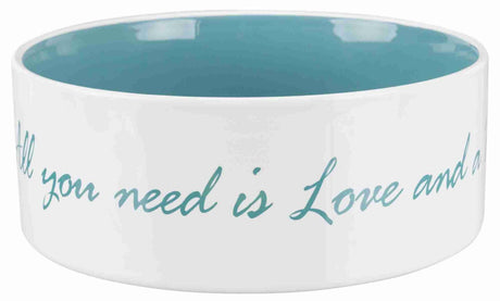 Weiße Schale mit hellblauer Innenseite und dem Text "All you need is Love and a" in hellblauer Schrift.