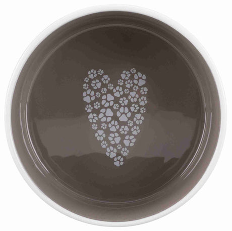 Runde graue Schale mit Pfotenabdruckmuster in Herzform im Inneren.