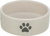 Beiger runder Napf mit schwarzem Pfotenabdruck auf der Außenseite.
