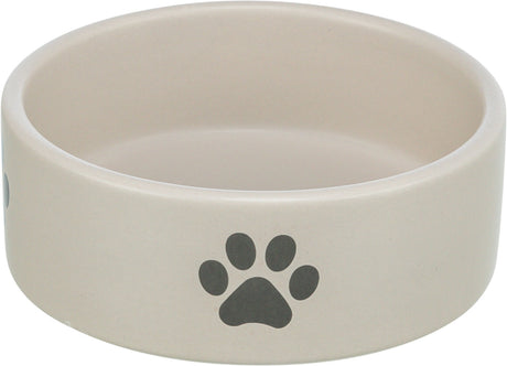 Beiger runder Napf mit schwarzem Pfotenabdruck auf der Außenseite.
