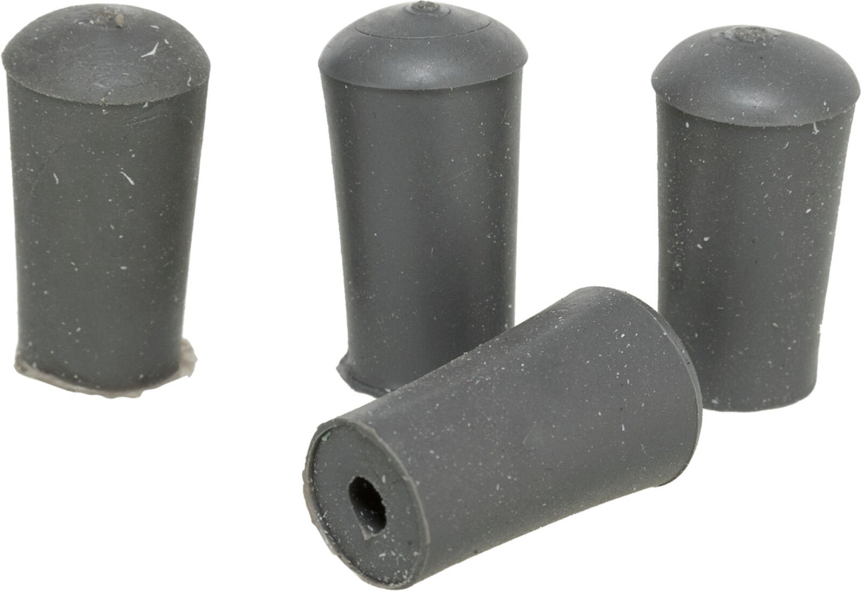 Vier graue zylindrische Objekte mit abgerundeten Kappen sind auf einem hellen Hintergrund angeordnet.