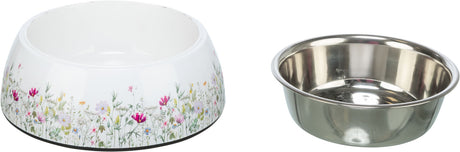 Zwei Futterschalen, eine aus Edelstahl, die andere weiß mit buntem Blumenmuster verziert.