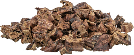 Ein Haufen brauner, getrockneter Stücke in unregelmäßiger Form, die eine raue und poröse Oberfläche zeigen.