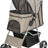 Ein beigefarbener Kinderwagen mit schwarzen Netzabdeckungen, vier Rädern und einem Griff für den Schiebevorgang.