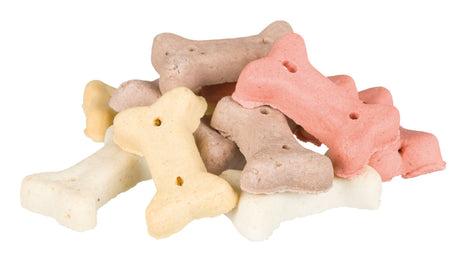 Ein Stapel bunter, knochenförmiger Hundekekse in den Farben Beige, Rosa und Gelb.