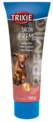 Tubenförmige Verpackung mit blauem Deckel, darauf "Trixie Bacon Creme" und Abbildung eines springenden Hundes.