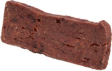 Ein rechteckiges, dickes, dunkelbraunes Stück mit rauer Textur und ungleichmäßiger Oberfläche.
