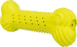 Gelbes Spielzeug in Knochenform mit Noppen und Löchern entlang der Oberfläche.
