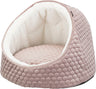 Ein weiches, rundes Hundebett in rosa mit wabenartiger Struktur und weißem, plüschigem Innenfutter.