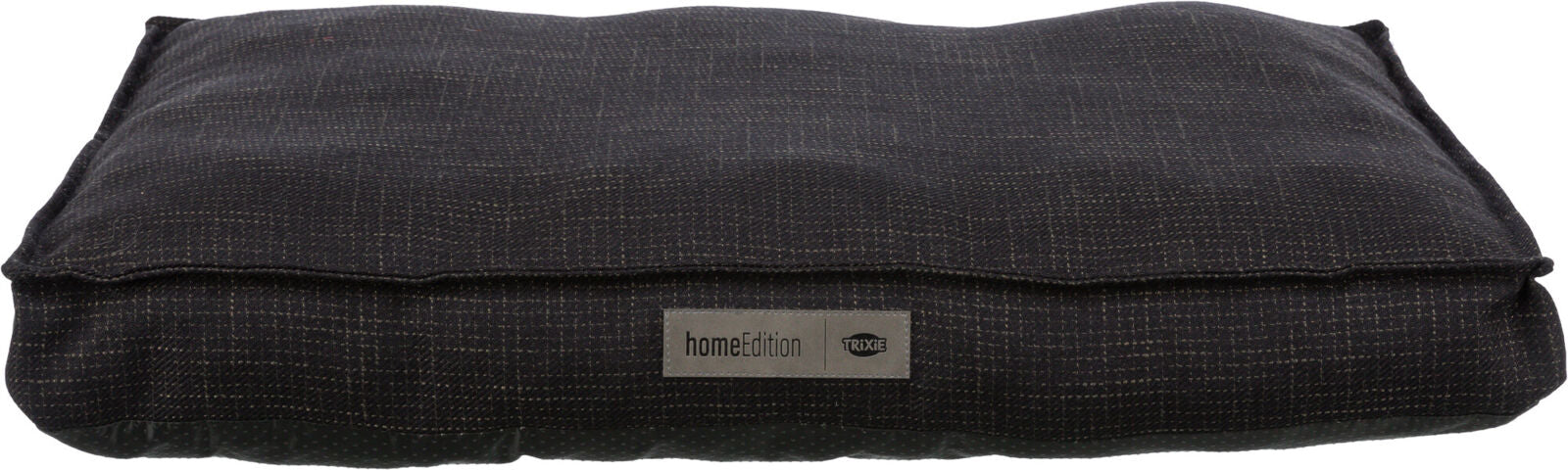 Rechteckiges, dunkles Kissen mit feinem Muster und einem Etikett mit der Aufschrift "homeEdition Trixie".
