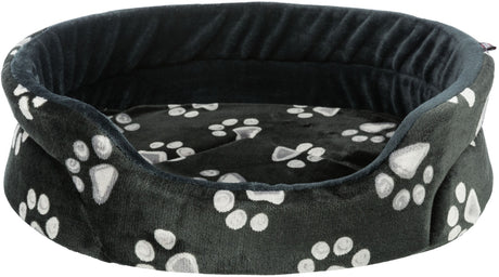 Rundes, flauschiges Bett mit dunkelgrauem Stoff, verziert mit weißen Pfotenabdrücken.