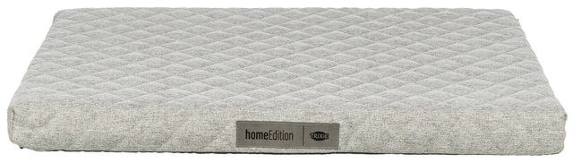 Graues, rechteckiges Polster mit rautenförmigem Muster, Label „homeEdition TRIXIE“ vorne sichtbar.