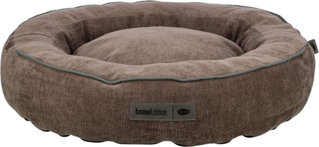 Braunes rundes Bett mit erhöhter Umrandung, grauer Kante und Labelaufschrift "homeEdition" und "TRIXIE".