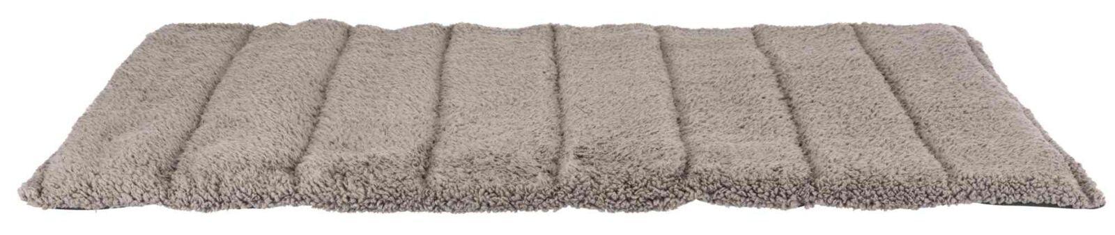 Beige, rechteckige, flauschige Matte mit gesteppten Abschnitten.